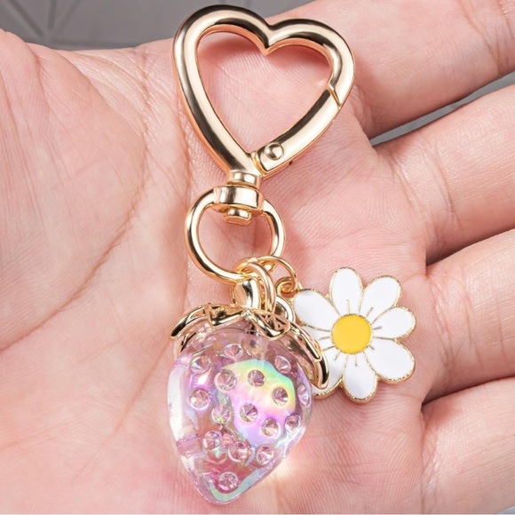 Strawberry iridescent color berry bag charm w/ white daisy and gold hear… - Picture 1 of 2